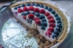 This 4th of July coconut cream pie is the epitome of a delicious summer dessert! It is light, creamy and full of fresh berries. Gluten-free, vegan, dairy-free.