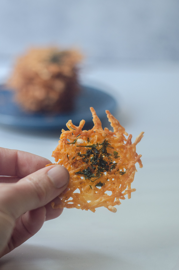 Craving a crunchy snack? These garlic and parsley parmesan crisps are super crispy and salty, and only take a few minutes to bake! Low-carb, keto, animal-based.