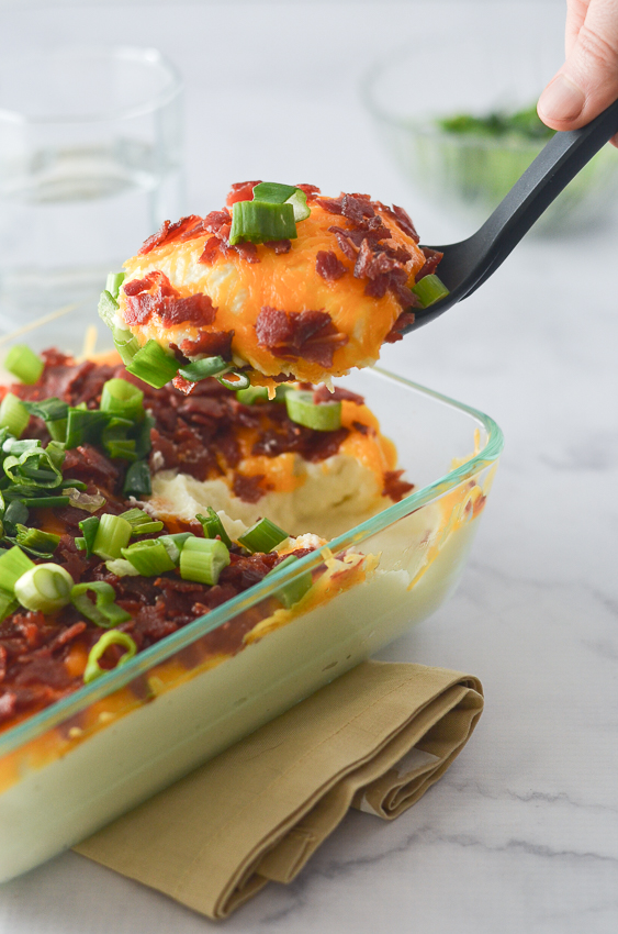 A delicious loaded cauliflower mash that rivals any good mashed potato recipe. Complete with tons of cheddar cheese, generous amounts of crispy bacon and lots of tangy green onions. You will certainly not miss those carb-filled potatoes, and may even impress some of your friends! Nightshade-free, low-carb, ketogenic, gluten-free, grain-free. 