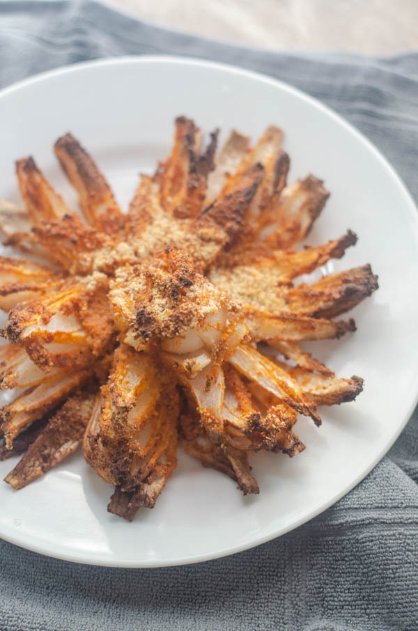 A delicious appetizer for special occasions, this air-fried blooming onion is a much healthier version of a favorite crunchy treat. Paleo, vegan, gluten-free. 