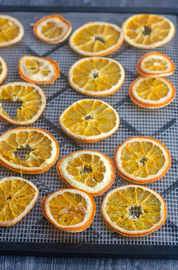 A simple, traditional holiday decoration or mulling spice recipe, these dehydrated orange slices are fun for the whole family!