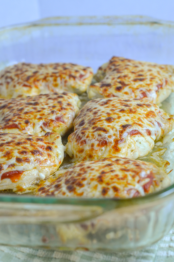 Gluten-free grilled chicken Parmesan. The chicken is seasoned and grilled, then topped with tomato sauce, Parmesan and mozzarella cheese and broiled until the cheese is bubbly and browned. Serve with your favorite vegetable and a gluten-free pasta of choice, and you have a perfect meal! Gluten-free, grain-free, low-carb, ketogenic.