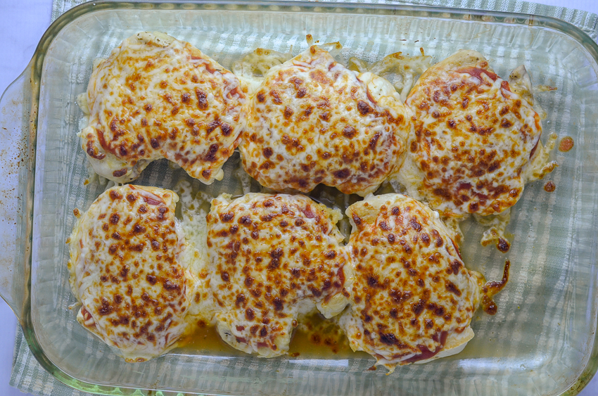 Gluten-free grilled chicken Parmesan. The chicken is seasoned and grilled, then topped with tomato sauce, Parmesan and mozzarella cheese and broiled until the cheese is bubbly and browned. Serve with your favorite vegetable and a gluten-free pasta of choice, and you have a perfect meal! Gluten-free, grain-free, low-carb, ketogenic.