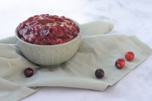 This easy homemade cranberry sauce is perfect for the holiday season! Thanksgiving, Christmas, or whenever the cravings strike! Paleo, low-carb, keto, sugar-free. 