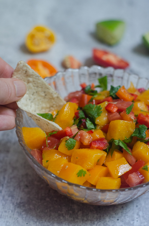 This recipe is the easiest peach salsa ever! Use diced peaches for a super quick and simple salsa that is ready in under 3 minutes. Paleo, vegan.