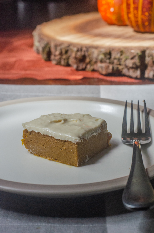 This pumpkin spice cake with cream cheese frosting is rich, sweet, tangy and perfect for a chilly fall evening! Gluten-free, animal-based. 