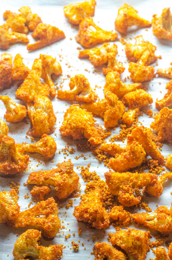 A delicious low-carb side dish or appetizer, these shake 'n bake cauliflower bites are easy to make and super tasty! Paleo, Whole30, vegan, keto.