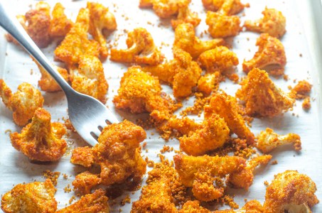 A delicious low-carb side dish or appetizer, these shake 'n bake cauliflower bites are easy to make and super tasty! Paleo, Whole30, vegan, keto.