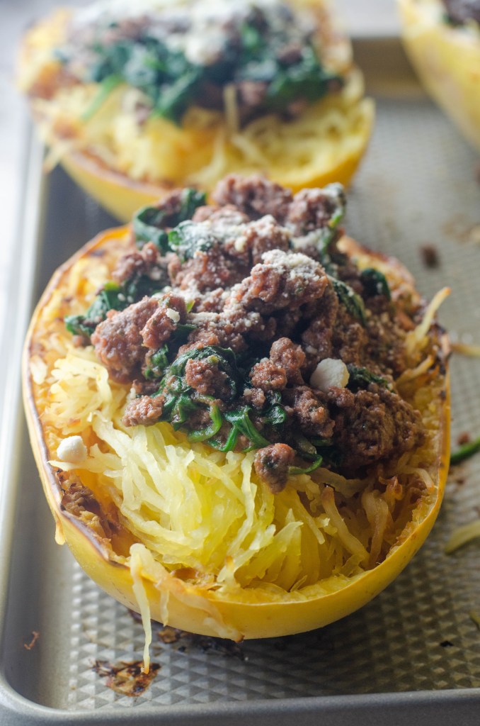 This spaghetti squash with meat sauce is a healthy alternative to a carb-filled dinner. Low-carb, paleo, whole30, gluten-free, grain-free, dairy-free.