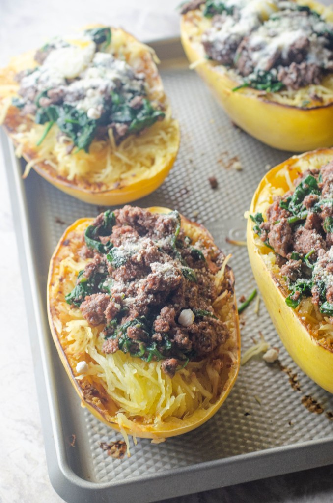 This spaghetti squash with meat sauce is a healthy alternative to a carb-filled dinner. Low-carb, paleo, whole30, gluten-free, grain-free, dairy-free.