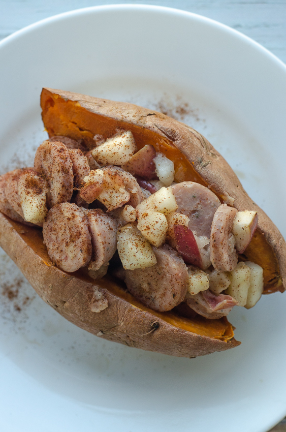 A delicious fall favorite, these stuffed sweet potatoes are loaded with apples, sweet chicken sausage and cinnamon butter! Paleo, Whole30, dairy-free, gluten-free, grain-free. 