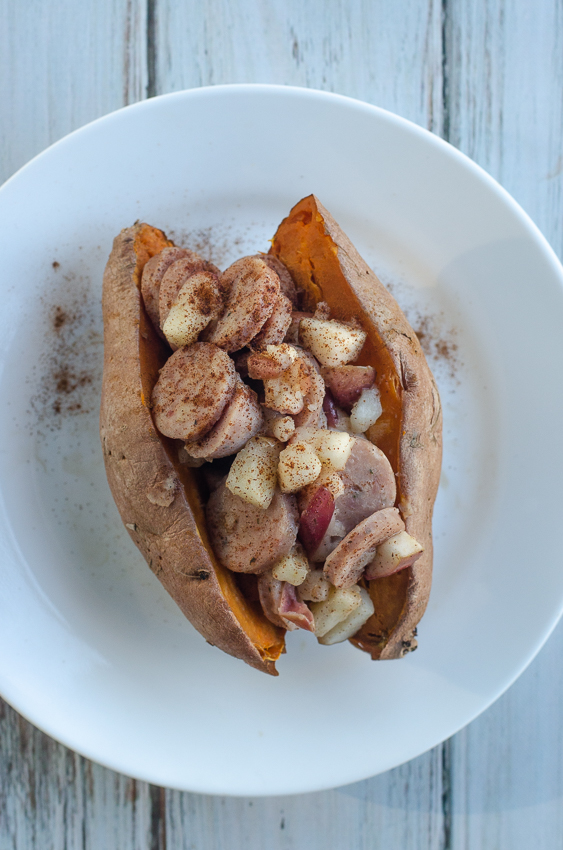 A delicious fall favorite, these stuffed sweet potatoes are loaded with apples, sweet chicken sausage and cinnamon butter! Paleo, Whole30, dairy-free, gluten-free, grain-free. 