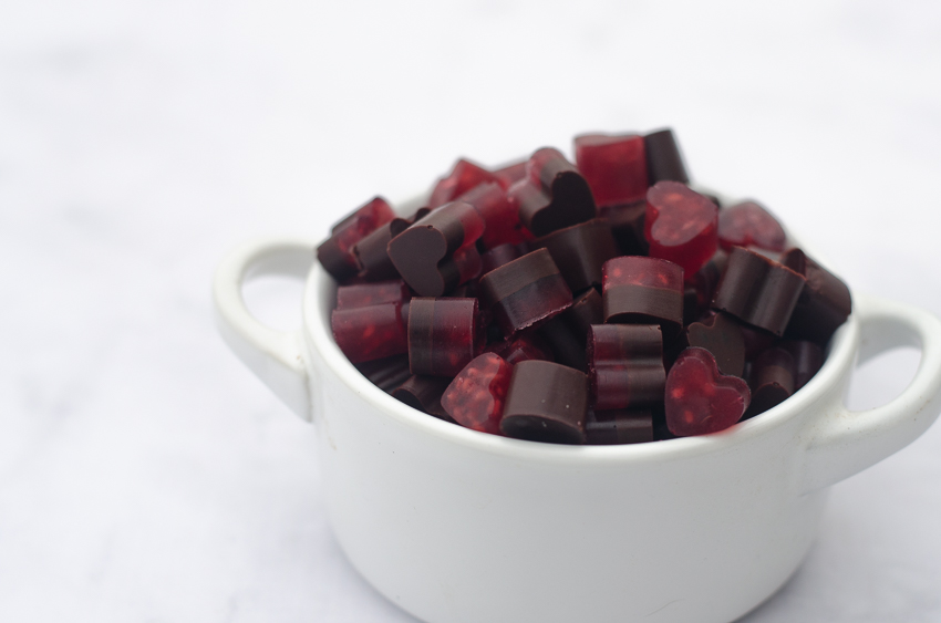 These raspberry chocolate gummy bears are the perfect Valentine's day treat! They are sweet, chewy and free of sugars, carbs and preservatives! Keto, low-carb, Paleo.