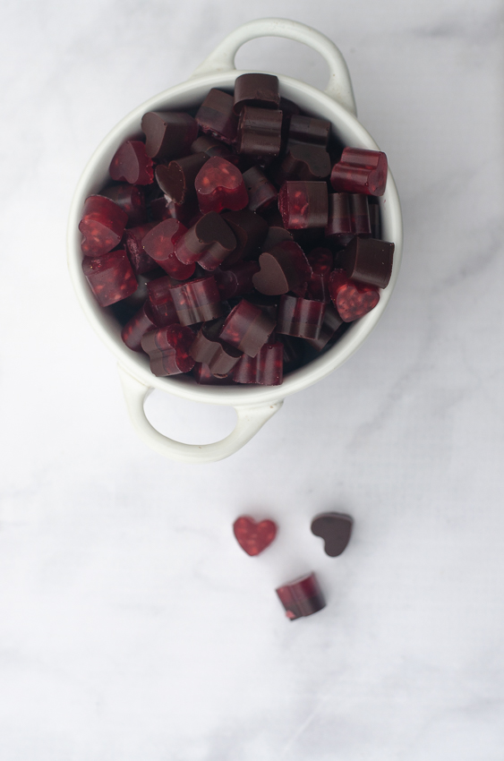 These raspberry chocolate gummy bears are the perfect Valentine's day treat! They are sweet, chewy and free of sugars, carbs and preservatives! Keto, low-carb, Paleo.